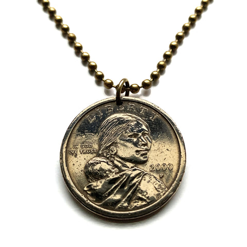 USA Dollar coin pendant Sacagawea Lemhi Shoshone native American Indian Agaidika Lewis & Clark expedition Fort Washakie Nevada Akaitikka Idaho Louisiana Salmon Eater North Dakota Missouri Rocky Mountains Wyoming Sakakawea Lemhi Pass Montana n003208