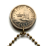 USA Dollar coin pendant Sacagawea Lemhi Shoshone native American Indian Agaidika Lewis & Clark expedition Fort Washakie Nevada Akaitikka Idaho Louisiana Salmon Eater North Dakota Missouri Rocky Mountains Wyoming Sakakawea Lemhi Pass Montana n003208