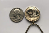 USA Dollar coin pendant Sacagawea Lemhi Shoshone native American Indian Agaidika Lewis & Clark expedition Fort Washakie Nevada Akaitikka Idaho Louisiana Salmon Eater North Dakota Missouri Rocky Mountains Wyoming Sakakawea Lemhi Pass Montana n003208