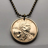USA Dollar coin pendant Sacagawea Lemhi Shoshone native American Indian Agaidika Lewis & Clark expedition Fort Washakie Nevada Akaitikka Idaho Louisiana Salmon Eater North Dakota Missouri Rocky Mountains Wyoming Sakakawea Lemhi Pass Montana n003208