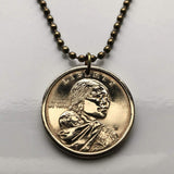 USA Dollar coin pendant Sacagawea Lemhi Shoshone native American Indian Agaidika Lewis & Clark expedition Fort Washakie Nevada Akaitikka Idaho Louisiana Salmon Eater North Dakota Missouri Rocky Mountains Wyoming Sakakawea Lemhi Pass Montana n003208