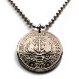 1907 Haiti 20 Centimes coin pendant Haitian flags cannons palm trees Port-au-Prince Cap-Haïtien Carrefour Delmas Pétion-Ville Port-de-Paix Croix des Bouquets Jacmel Léogâne Les Cayes Citadelle Laferrière Sans-Souci Palace Minot Artibonite Gonaïves n001600