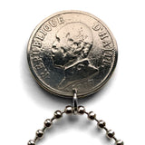 1907 Haiti 20 Centimes coin pendant Haitian flags cannons palm trees Port-au-Prince Cap-Haïtien Carrefour Delmas Pétion-Ville Port-de-Paix Croix des Bouquets Jacmel Léogâne Les Cayes Citadelle Laferrière Sans-Souci Palace Minot Artibonite Gonaïves n001600