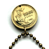 1996 Turkey Türkiye 5000 Lira coin pendant Mustafa Kemal Ataturk crescent moon star tulip flower sprigs Istanbul Ankara Mardin Antalya Canakkale Troy Trabzon Anatolia Göreme Kaş Ephesus Cappadocia Hierapolis İzmir Bursa Hattusa Levent Ottoman n003434