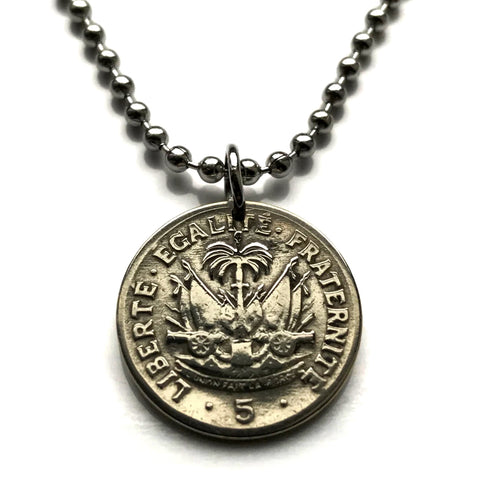 1958 Haiti 5 Centimes coin pendant Haitian flags cannons palm trees Port-au-Prince Cap-Haïtien Carrefour Delmas Pétion-Ville Port-de-Paix Croix des Bouquets Jacmel Léogâne Les Cayes Citadelle Laferrière Sans-Souci Palace Minot Artibonite Gonaïves n001510