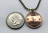 1975 Oman 10 Baisa coin pendant palm trees Muscat Ibri Saham Barka Rustaq Arab Wahiba Sands Bat Al-Khutm Al-Ayn Seeb Salalah Bawshar Sohar Suwayq Dhofar Al Batinah Nakhal Bahla Fort Nabhani dynasty Al-Lawatia Muttrah khanjar dagger crossed sword n002715